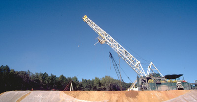 Photograph of mast being raised.